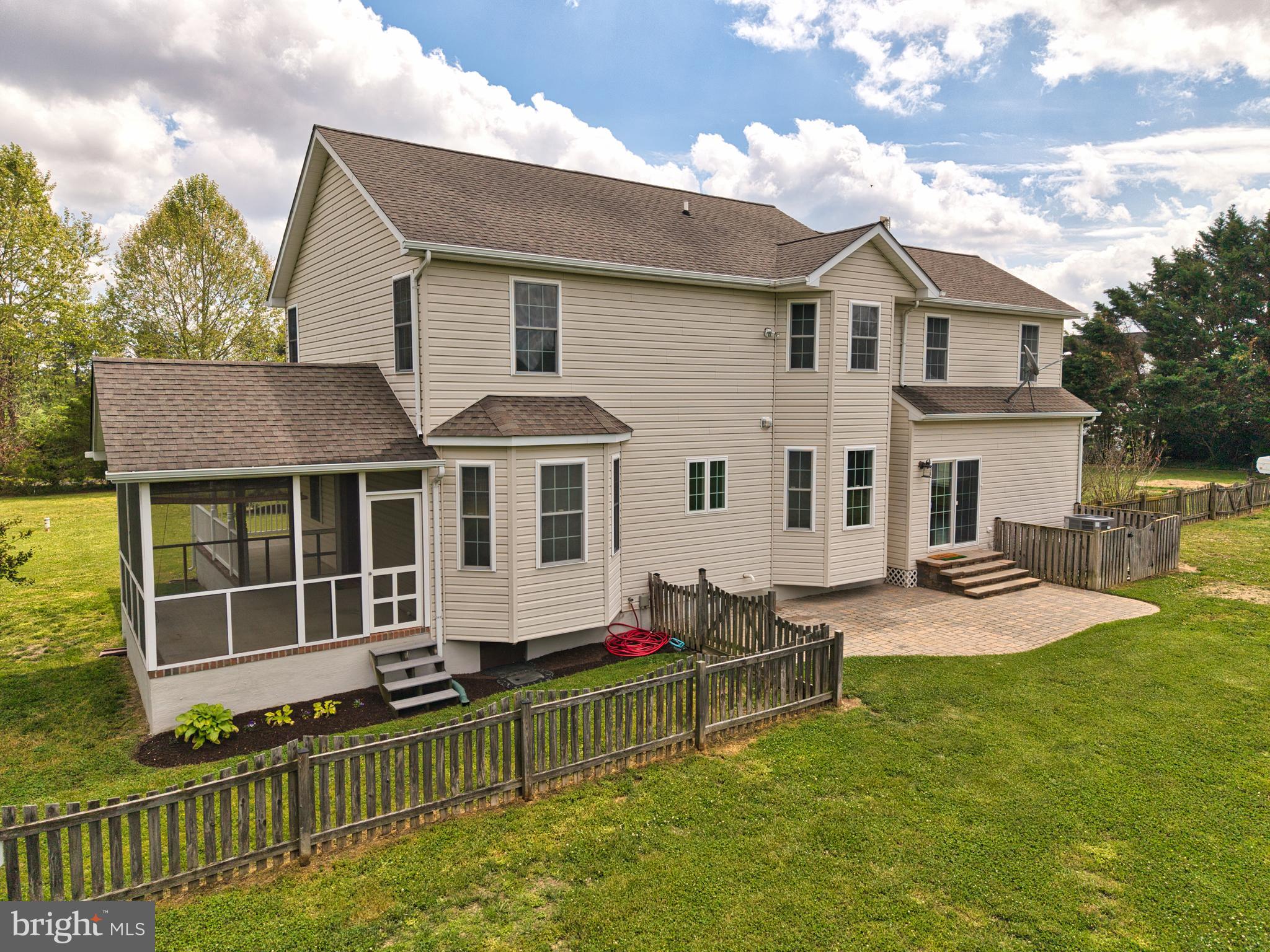 337 Roe Ingleside Road Centreville, MD 21617 - Photo 9 of 56 a front view of a house with a yard table and chairs
