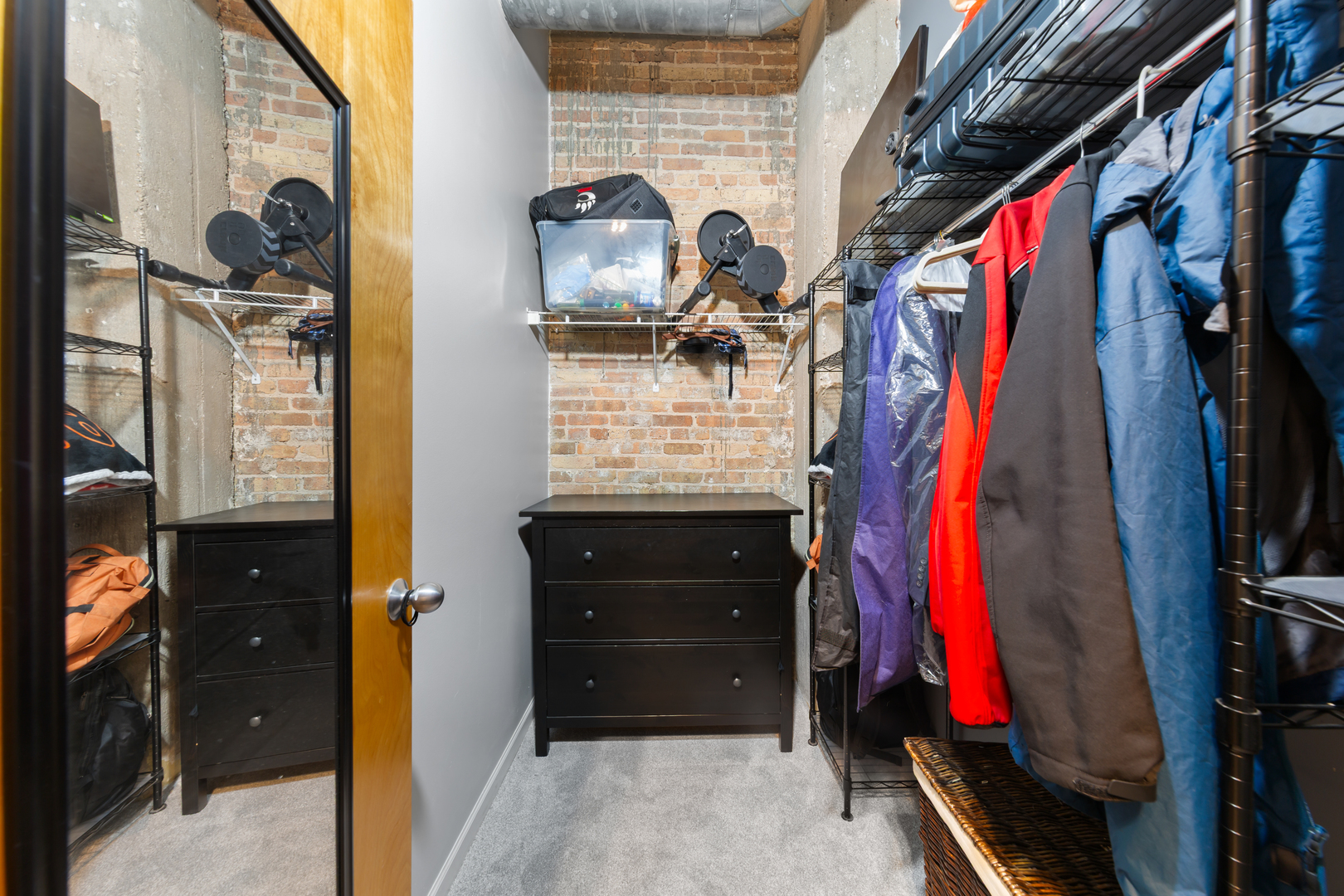 215 North Aberdeen Street, Unit 403A Chicago, IL 60607 - Photo 16 of 22 a view of walk in closet with clothes and shoes