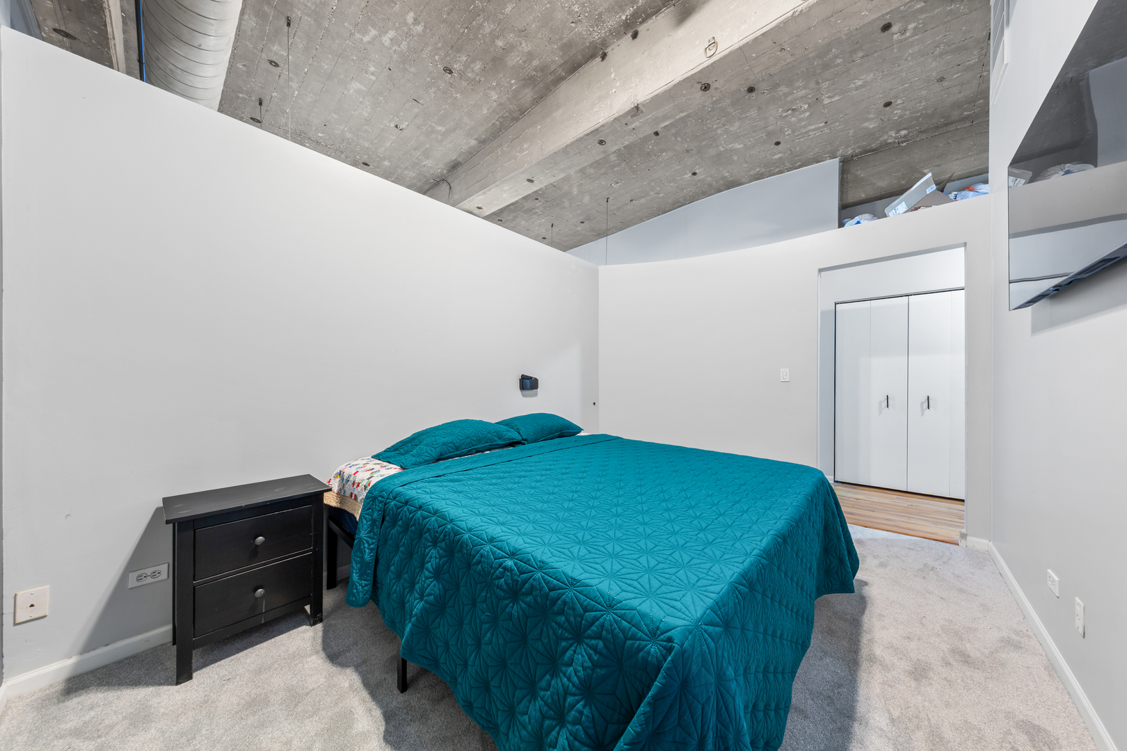 215 North Aberdeen Street, Unit 403A Chicago, IL 60607 - Photo 10 of 22 a bedroom with a bed and a desk