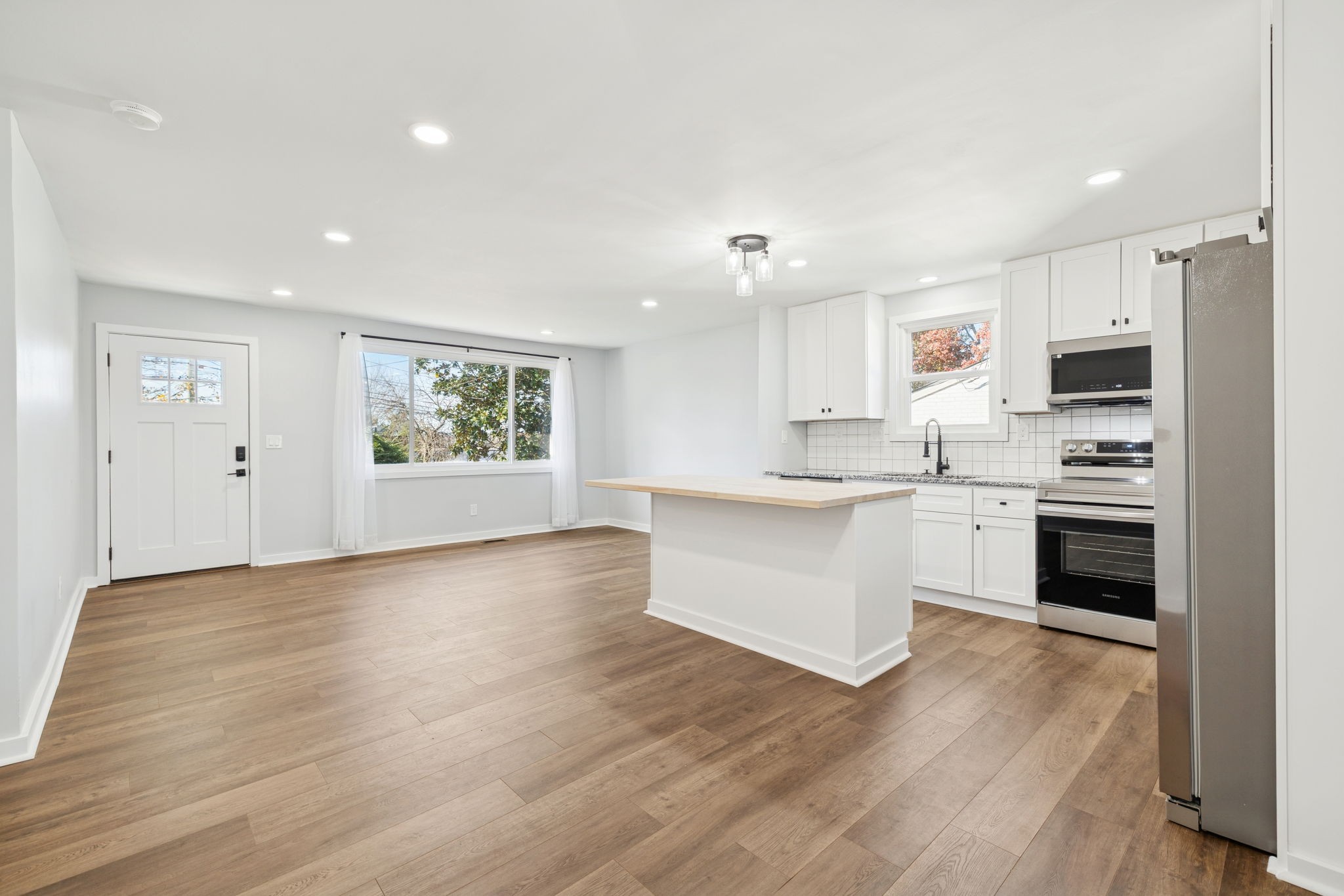 3103 Hillside Road Nashville, TN 37207 - Photo 5 of 23 a kitchen with stainless steel appliances a white stove top oven and a refrigerator