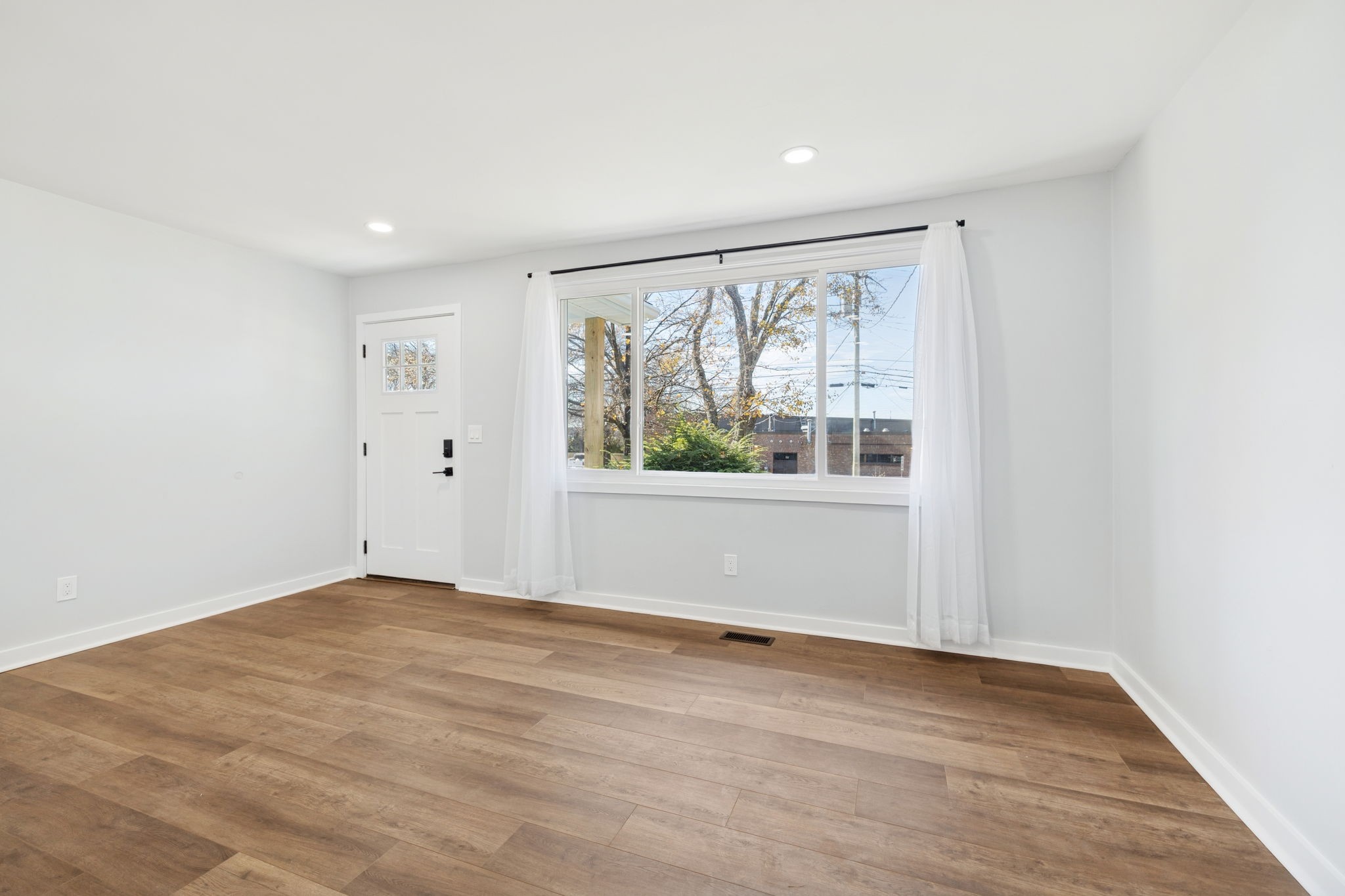 3103 Hillside Road Nashville, TN 37207 - Photo 6 of 23 an empty room with wooden floor and windows