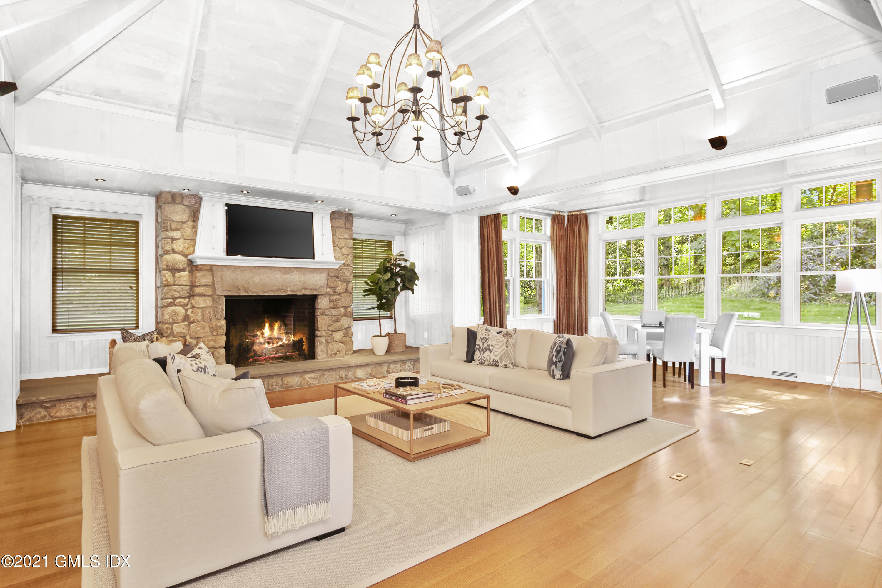 33 Brookridge Drive Greenwich, CT 06830 - Photo 16 of 44 a living room with furniture large window and a fireplace