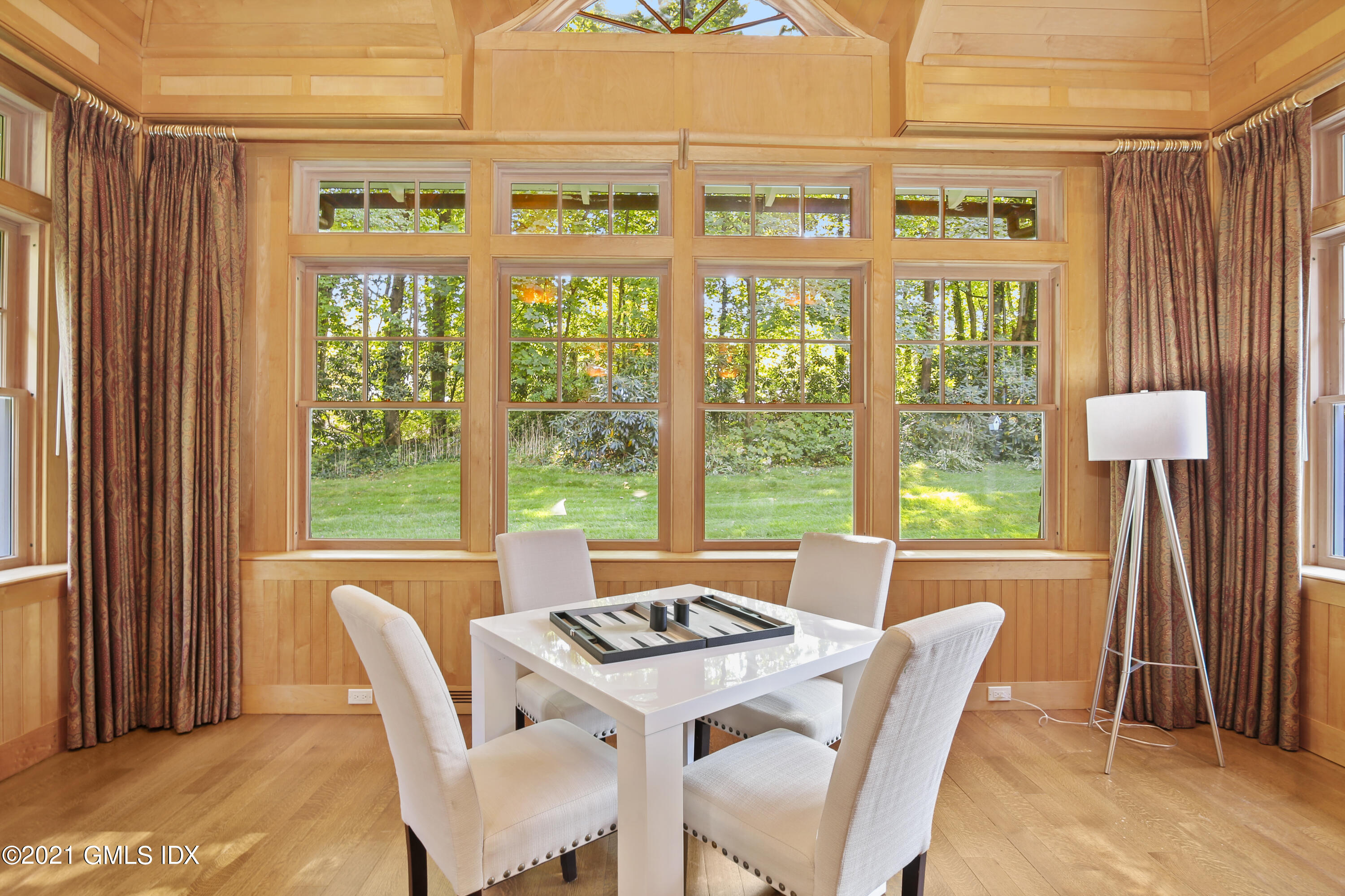 33 Brookridge Drive Greenwich, CT 06830 - Photo 20 of 44 a view of a dining room with furniture and large windows