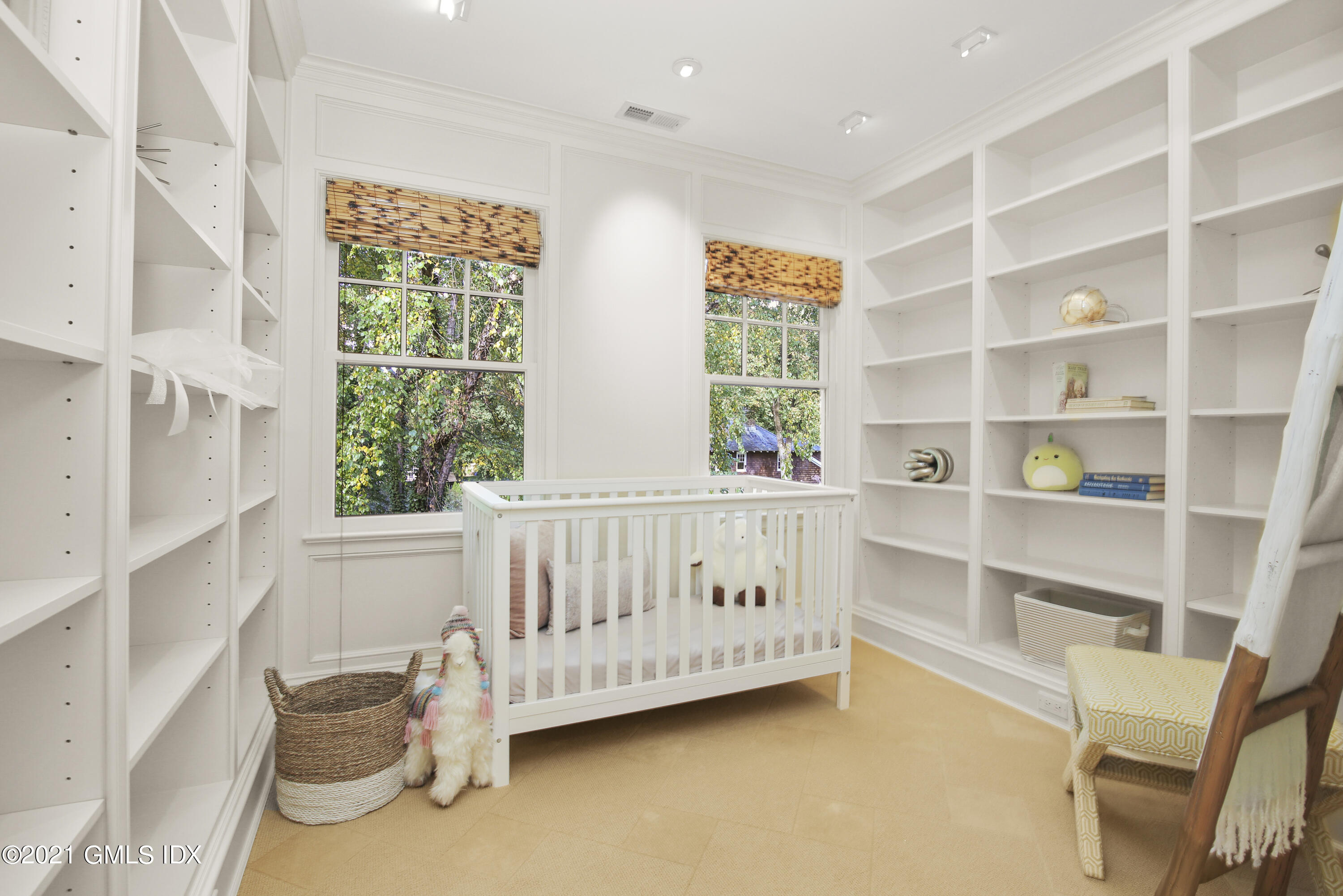 33 Brookridge Drive Greenwich, CT 06830 - Photo 27 of 44 a view of a bedroom with a window and shelf
