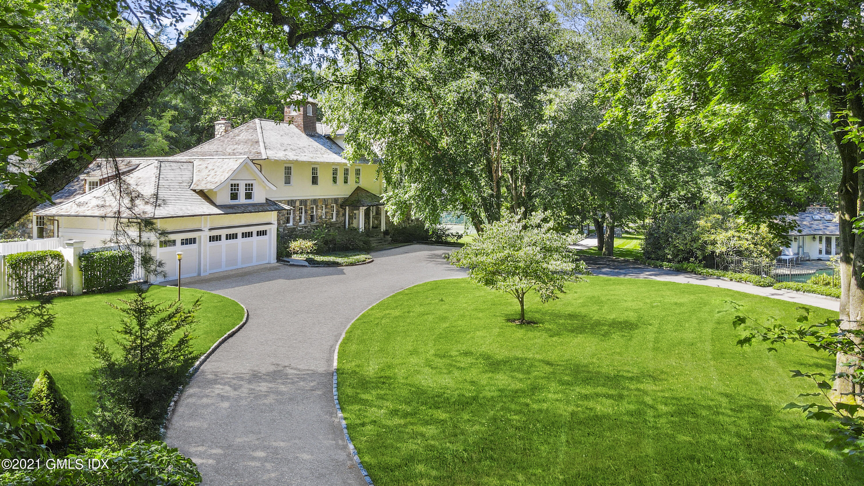 33 Brookridge Drive Greenwich, CT 06830 - Photo 43 of 44 a front view of a house with garden