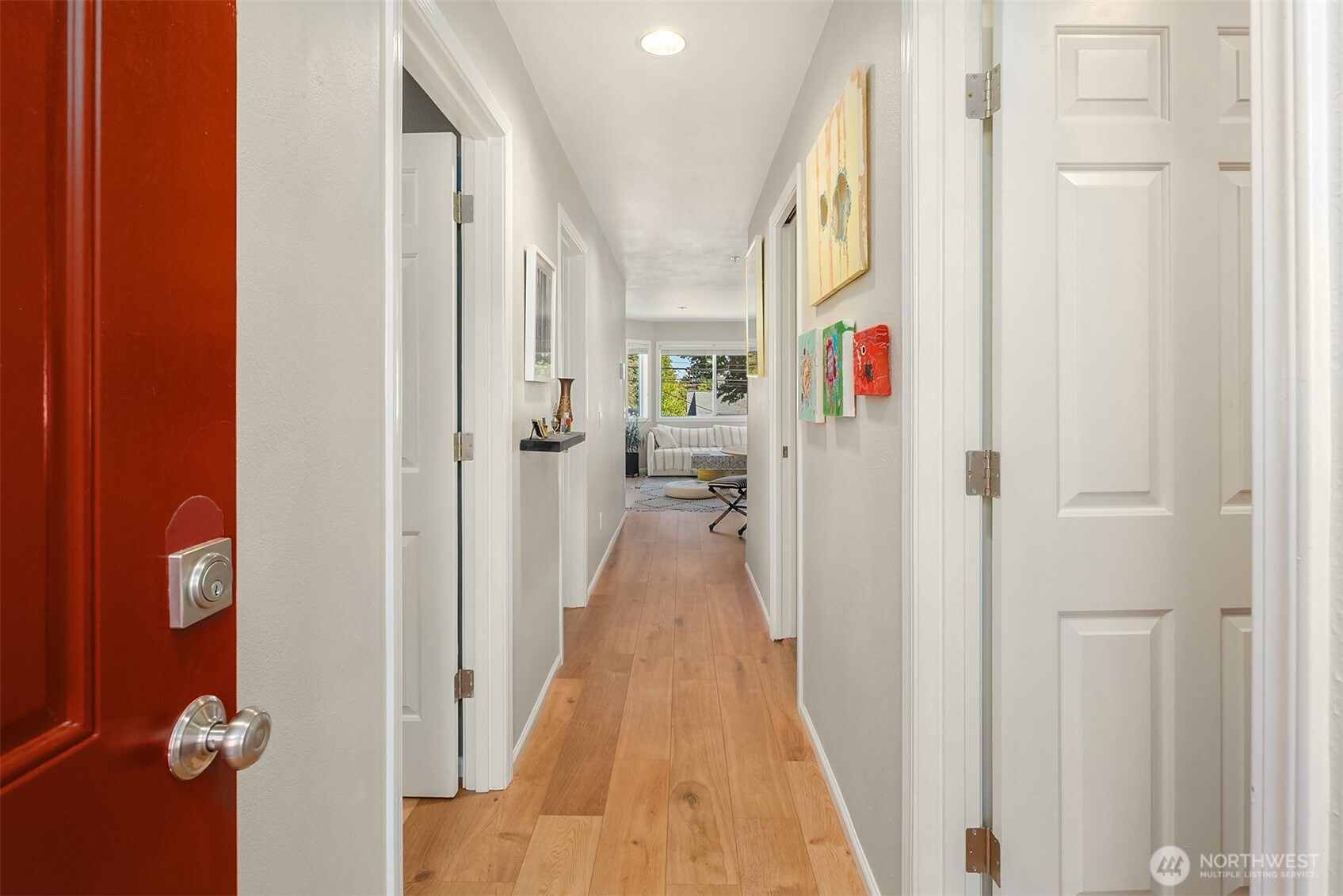 2116 California Avenue Southwest, Unit 201 Seattle, WA 98116 - Photo 14 of 17 a view of a hallway with wooden floor