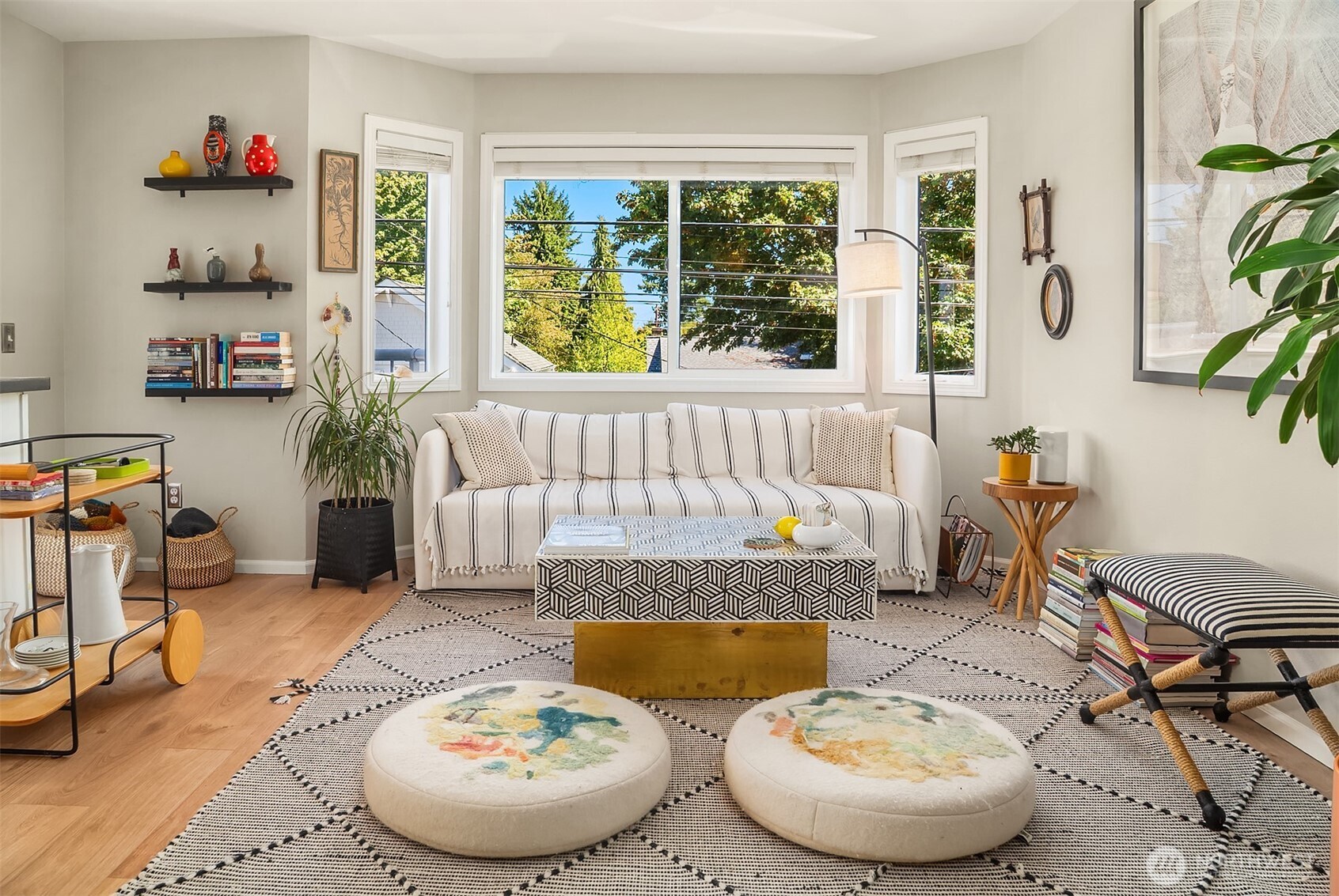 2116 California Avenue Southwest, Unit 201 Seattle, WA 98116 - Photo 4 of 17 a living room with furniture and a large window