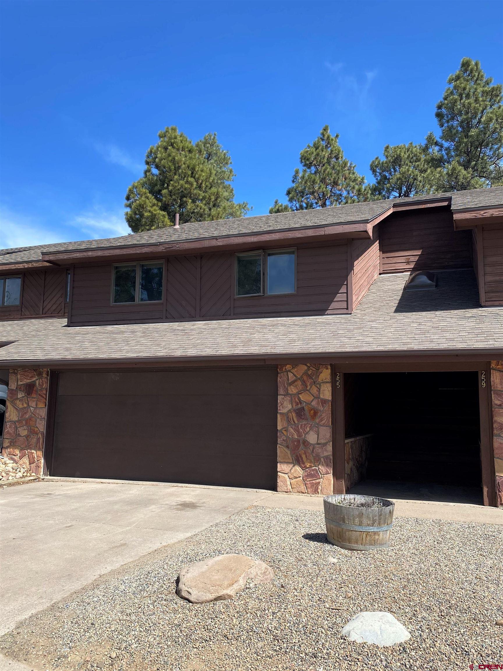 255 Pine Ridge Loop, Unit C5 Durango, CO 81301 - Photo 1 of 32 a front view of a house with a garage