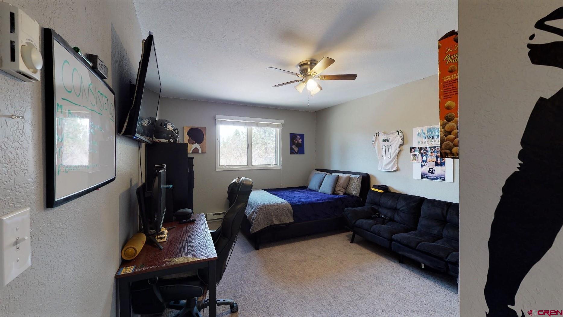 255 Pine Ridge Loop, Unit C5 Durango, CO 81301 - Photo 13 of 32 a bedroom with furniture and a window