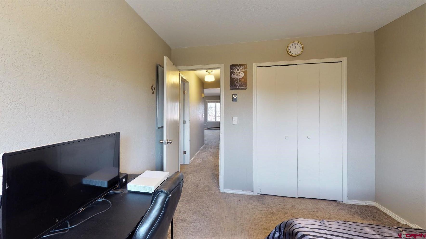 255 Pine Ridge Loop, Unit C5 Durango, CO 81301 - Photo 18 of 32 a living room with furniture and a flat screen tv