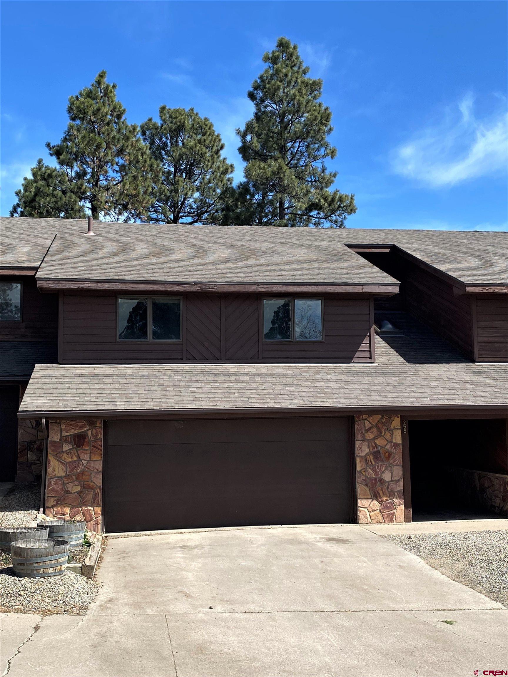 255 Pine Ridge Loop, Unit C5 Durango, CO 81301 - Photo 2 of 32 a front view of a house with a yard