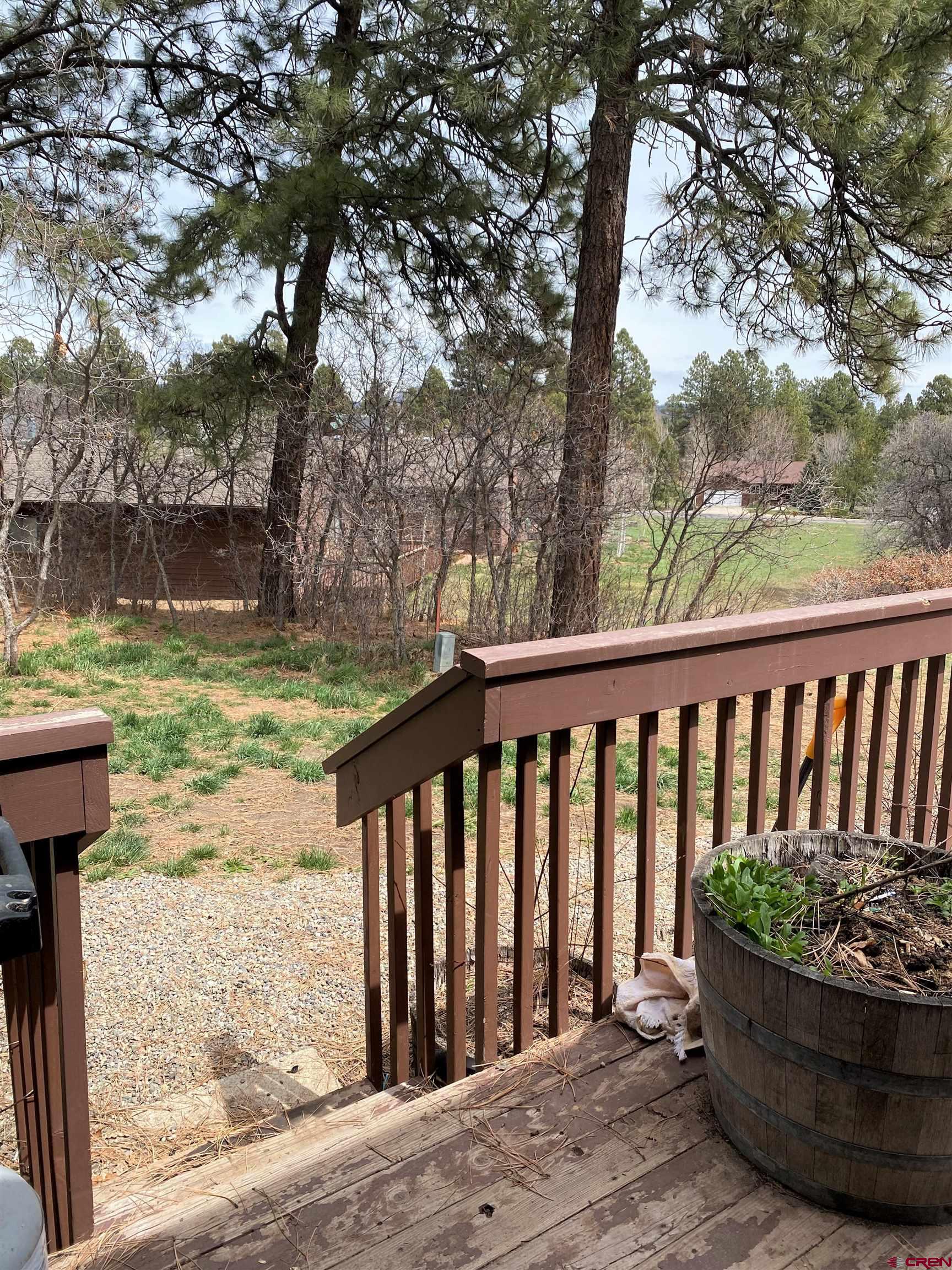 255 Pine Ridge Loop, Unit C5 Durango, CO 81301 - Photo 28 of 32 a view of a wooden deck with a patio
