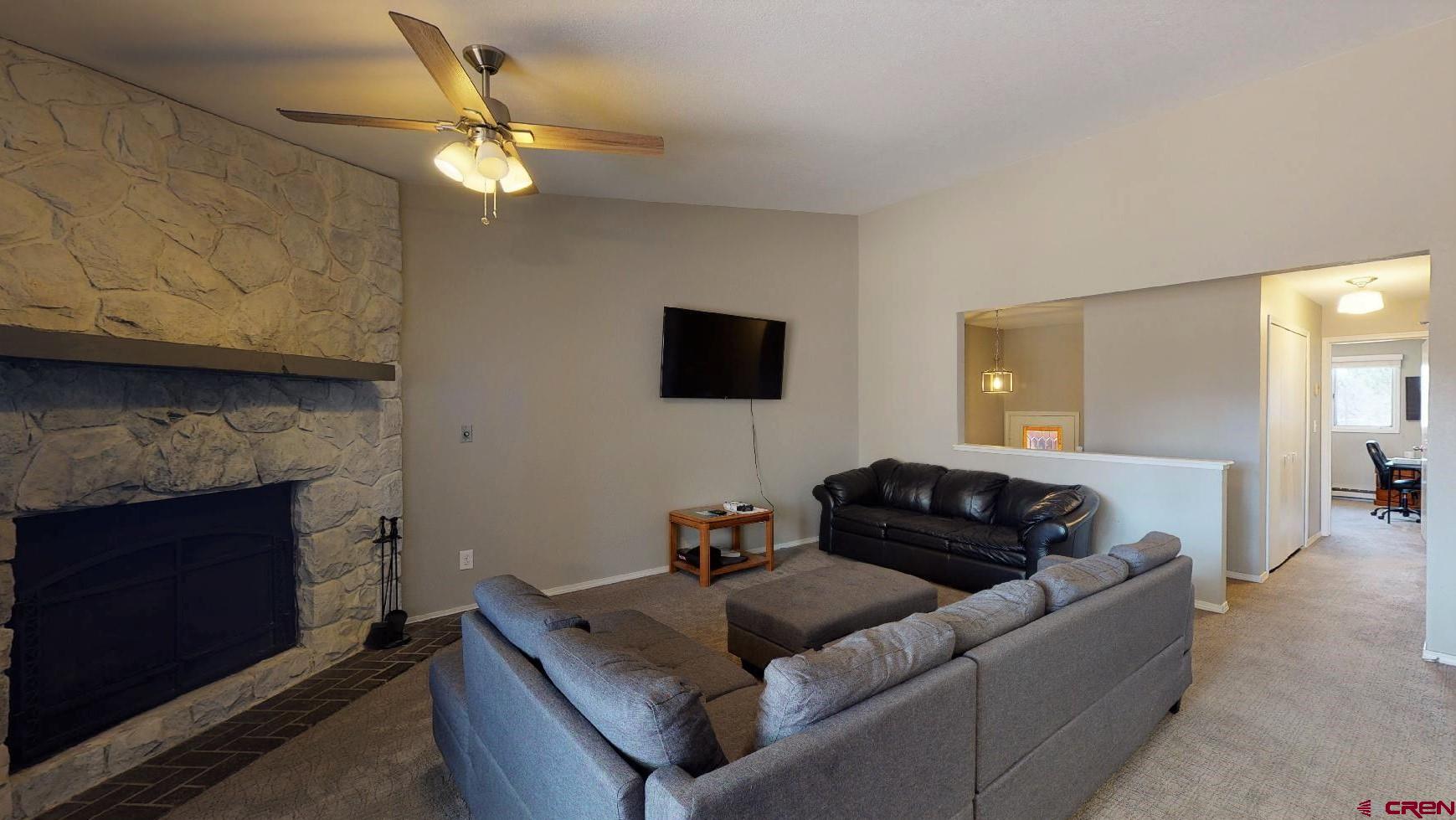 255 Pine Ridge Loop, Unit C5 Durango, CO 81301 - Photo 6 of 32 a living room with furniture and a fireplace