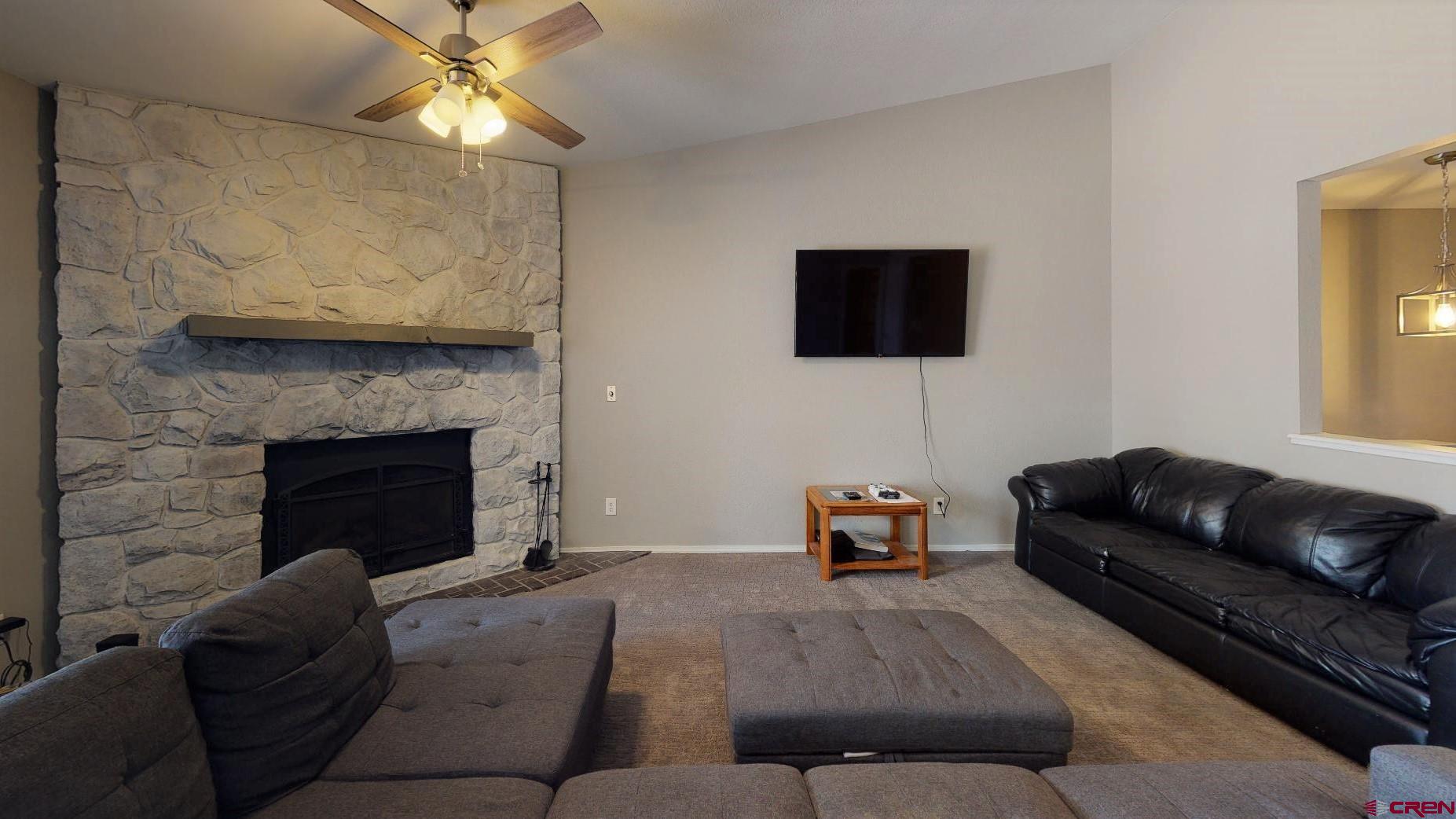 255 Pine Ridge Loop, Unit C5 Durango, CO 81301 - Photo 7 of 32 a living room with furniture and a fireplace