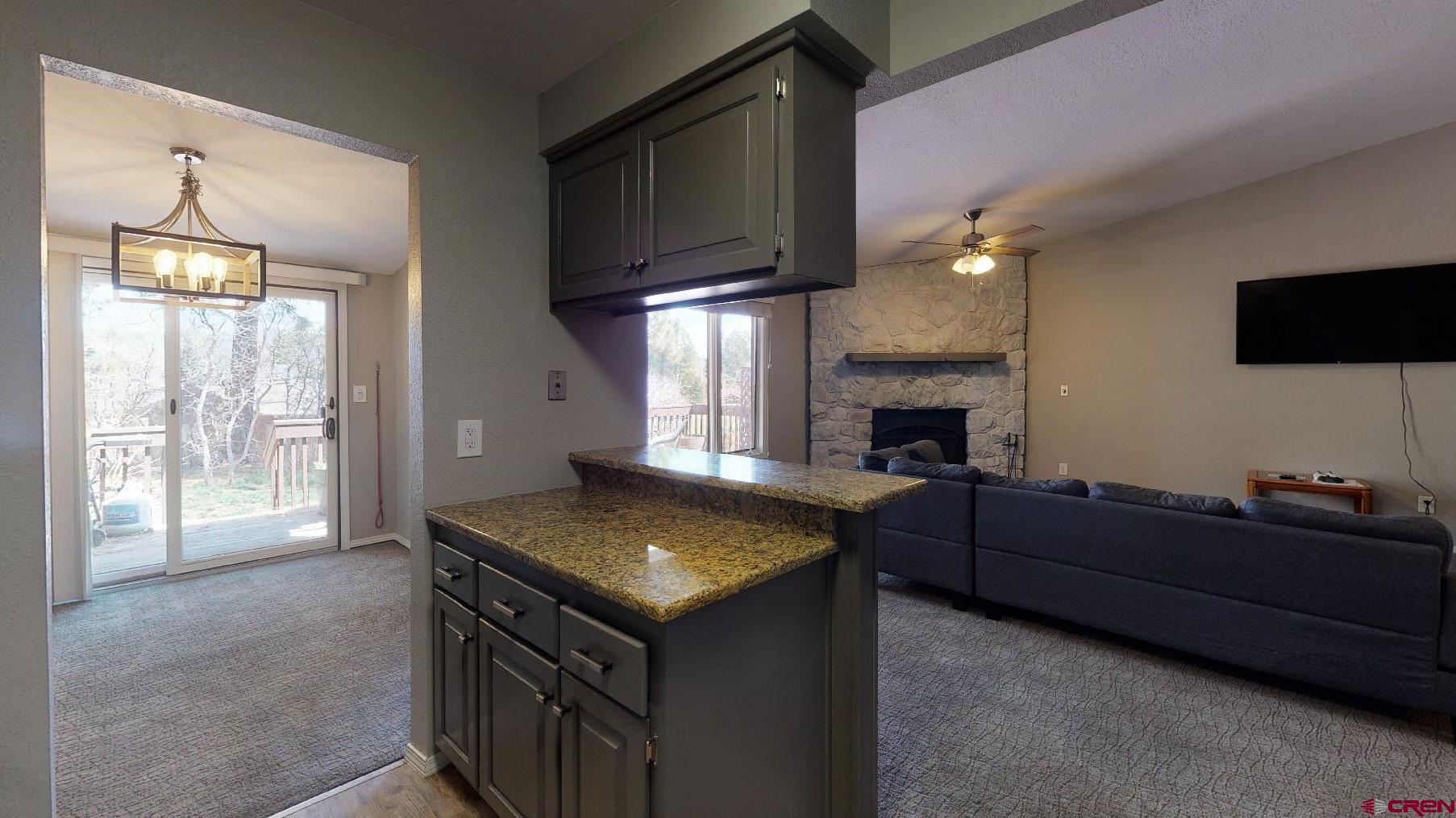 255 Pine Ridge Loop, Unit C5 Durango, CO 81301 - Photo 10 of 32 a living room with furniture and a fireplace