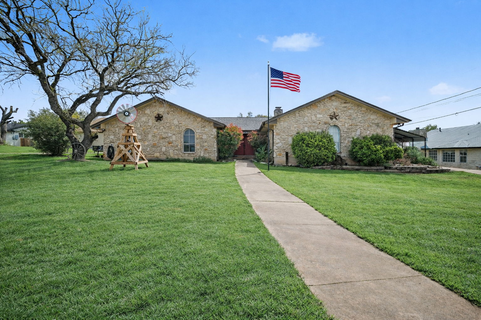 103 Oak Ridge Circle Georgetown, TX 78628 - Photo 1 of 22 View of front facade with stone siding and a front yard