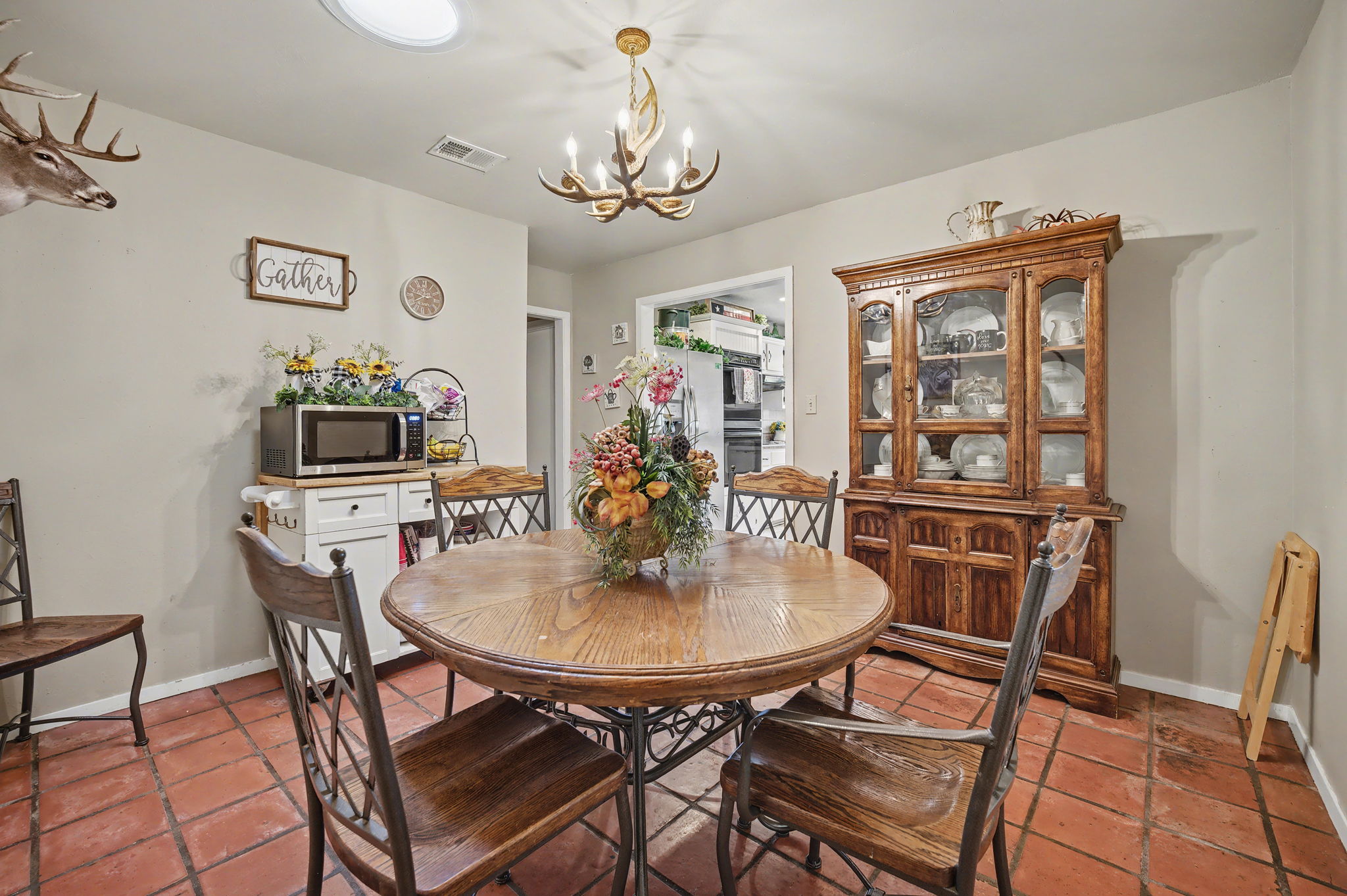 103 Oak Ridge Circle Georgetown, TX 78628 - Photo 13 of 22 Tiled dining area featuring baseboards and suspended lighting