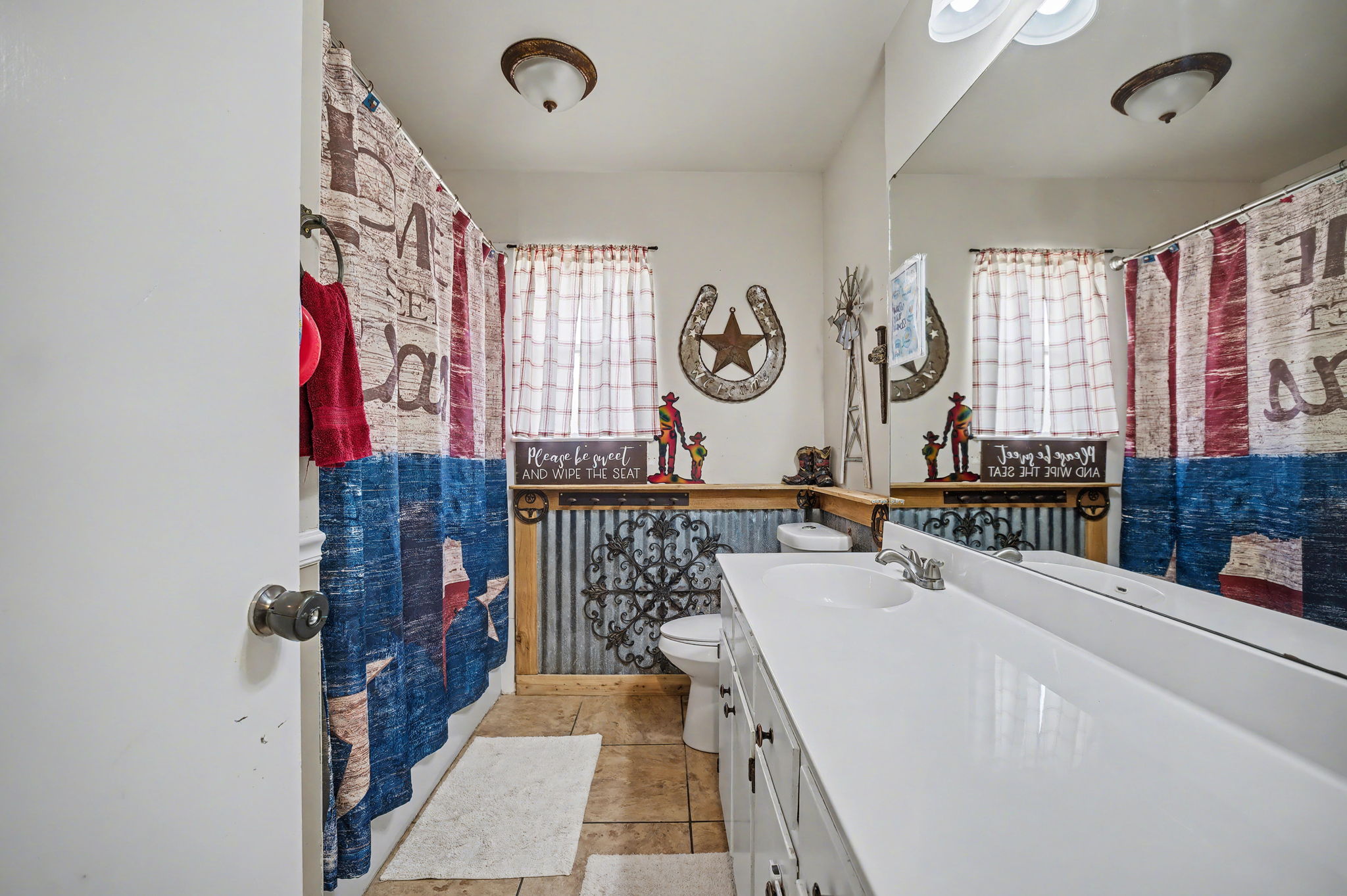 103 Oak Ridge Circle Georgetown, TX 78628 - Photo 17 of 22 Bathroom featuring a shower with curtain, vanity, and light tile patterned floors