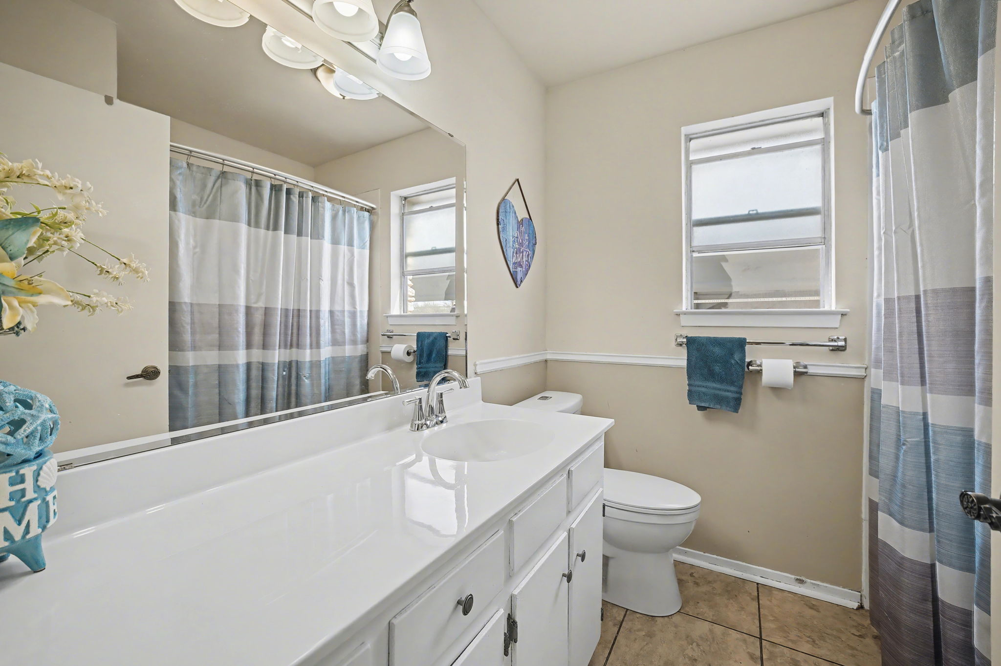 103 Oak Ridge Circle Georgetown, TX 78628 - Photo 20 of 22 Bathroom featuring vanity, light tile patterned flooring, and curtained shower