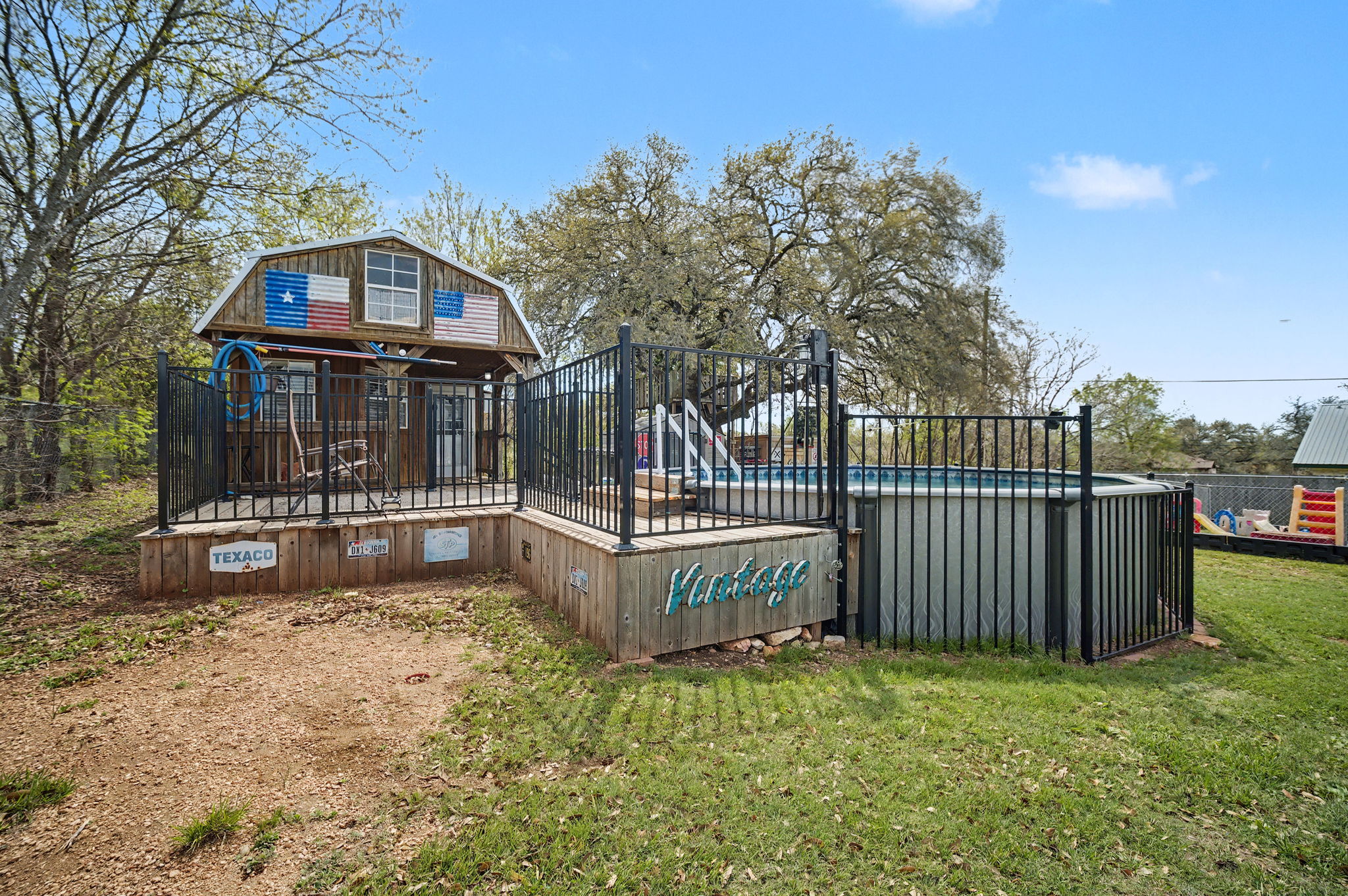 103 Oak Ridge Circle Georgetown, TX 78628 - Photo 4 of 22 Rear view of house with an outdoor pool