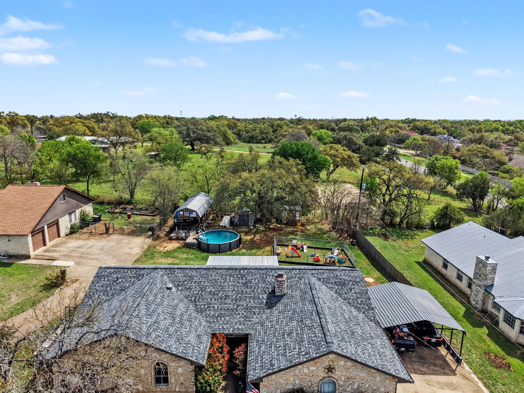 103 Oak Ridge Circle Georgetown, TX 78628 - Photo 7 of 22 Aerial view of a tree filled landscape
