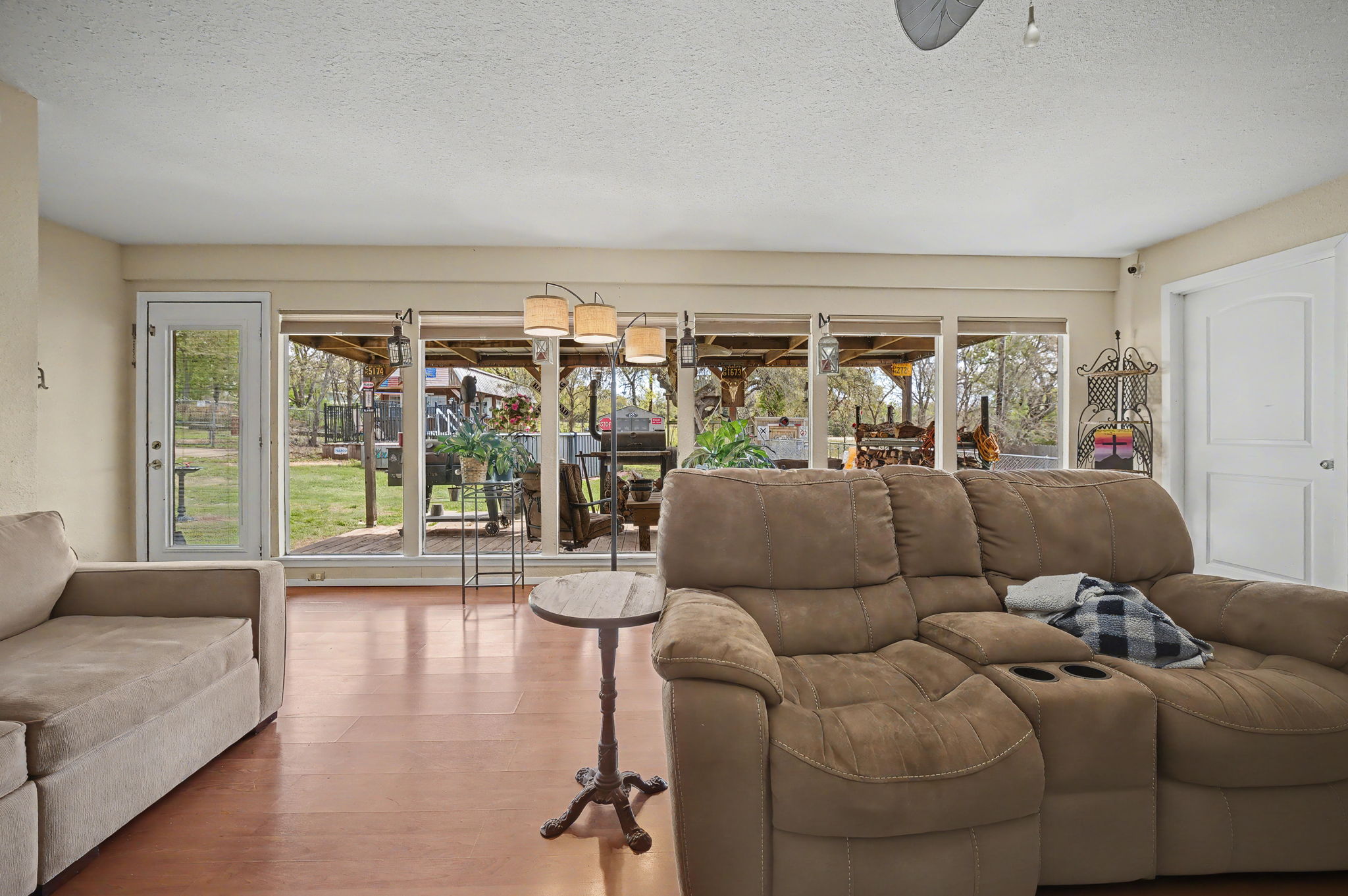 103 Oak Ridge Circle Georgetown, TX 78628 - Photo 10 of 22 Living room with wood finished floors, a textured ceiling, and a ceiling fan