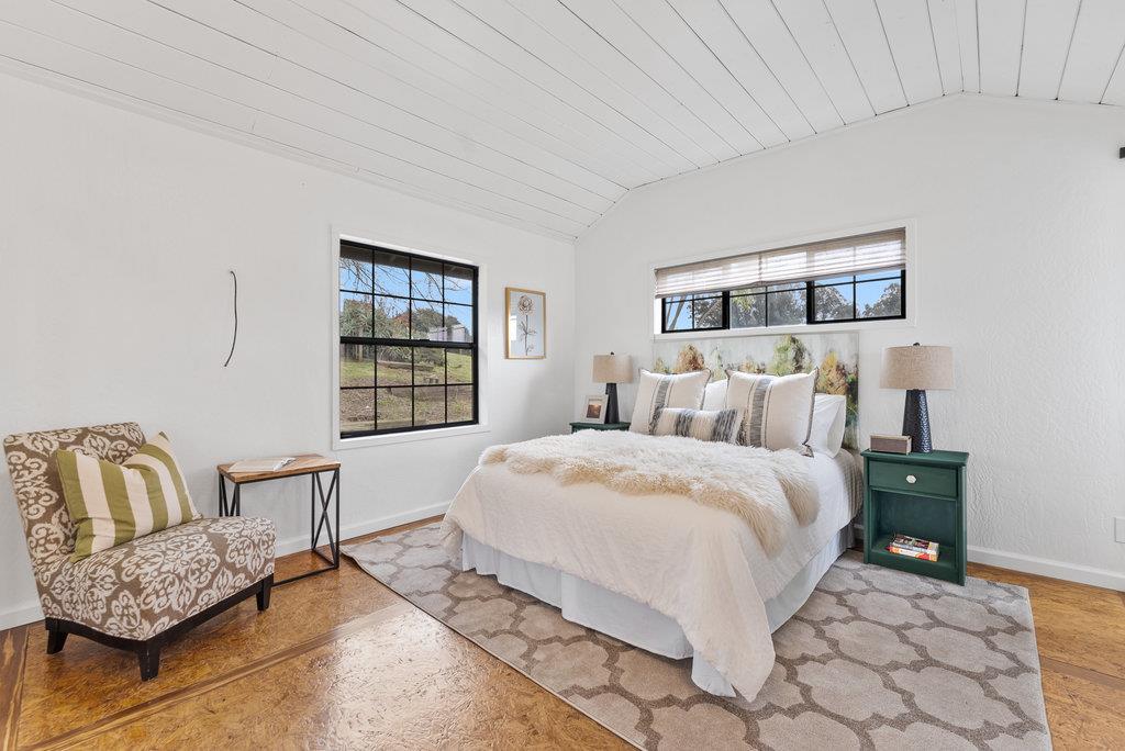 98 Paddon Road Watsonville, CA 95076 - Photo 15 of 28 a bedroom with a bed and a couch