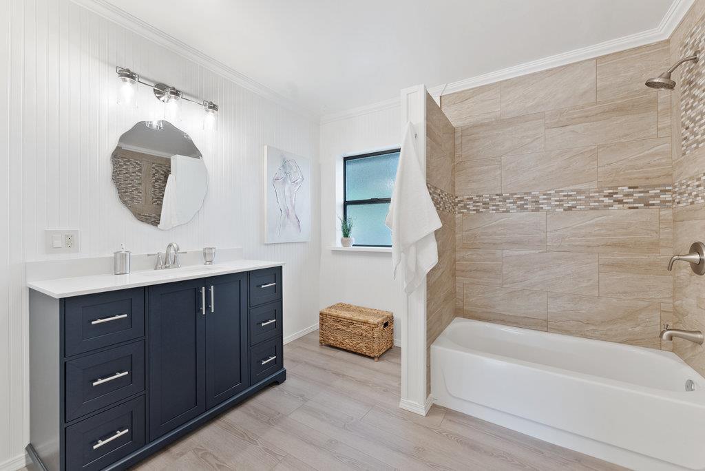 98 Paddon Road Watsonville, CA 95076 - Photo 17 of 28 a bathroom with a tub sink double vanity and mirror