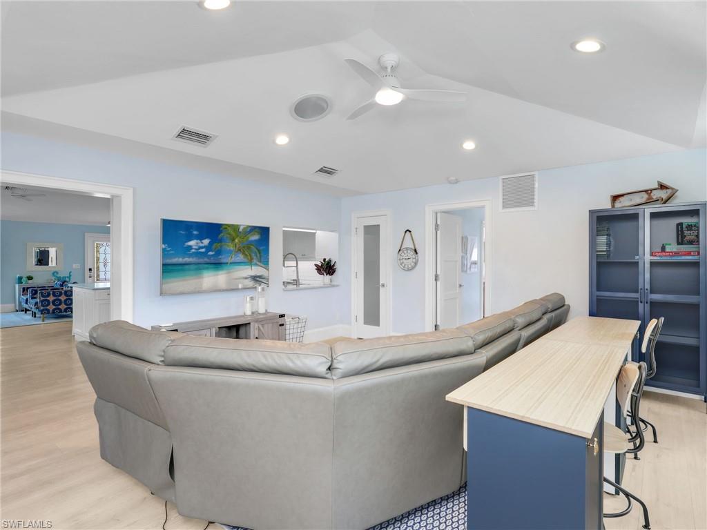 188 Columbus Way Marco Island, FL 34145 - Photo 12 of 38 Living room with ceiling fan, light wood-style floors, recessed lighting, and lofted ceiling