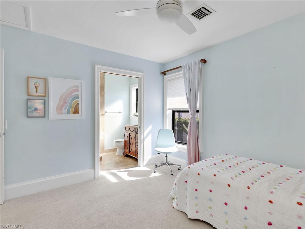 188 Columbus Way Marco Island, FL 34145 - Photo 18 of 38 Carpeted bedroom featuring ensuite bath and ceiling fan