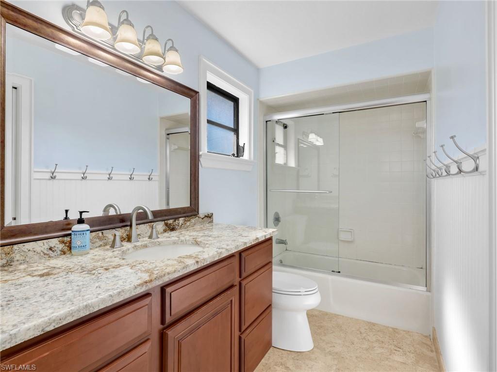 188 Columbus Way Marco Island, FL 34145 - Photo 22 of 38 Bathroom featuring vanity and enclosed tub / shower combo