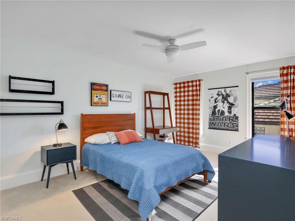 188 Columbus Way Marco Island, FL 34145 - Photo 23 of 38 Bedroom with a ceiling fan and light carpet