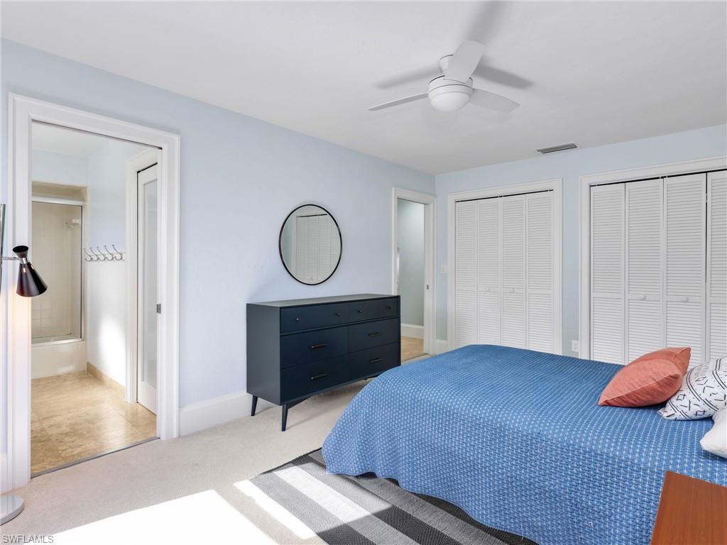 188 Columbus Way Marco Island, FL 34145 - Photo 24 of 38 Bedroom with two closets, carpet floors, and ceiling fan
