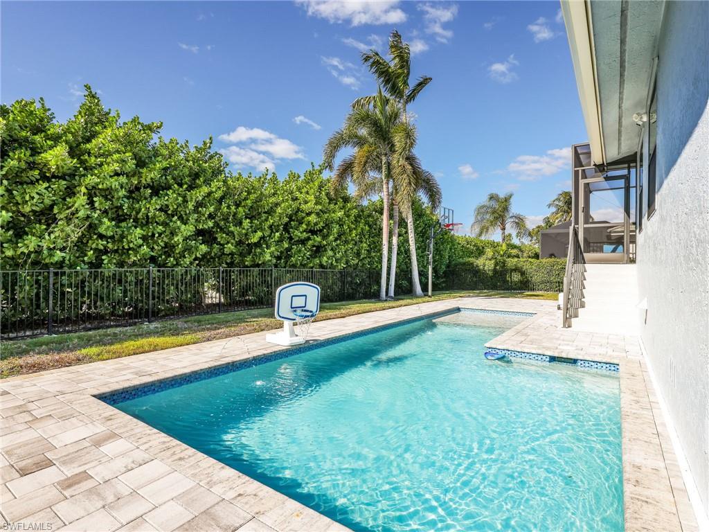 188 Columbus Way Marco Island, FL 34145 - Photo 3 of 38 View of swimming pool featuring a patio area and a fenced backyard