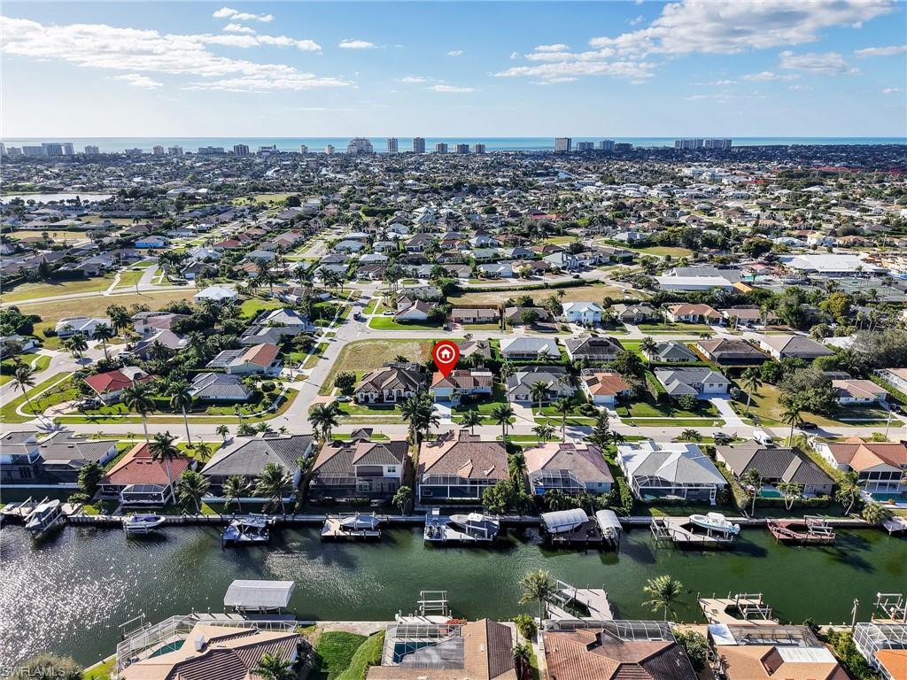 188 Columbus Way Marco Island, FL 34145 - Photo 33 of 38 View of urban area featuring a large body of water and nearby suburban area
