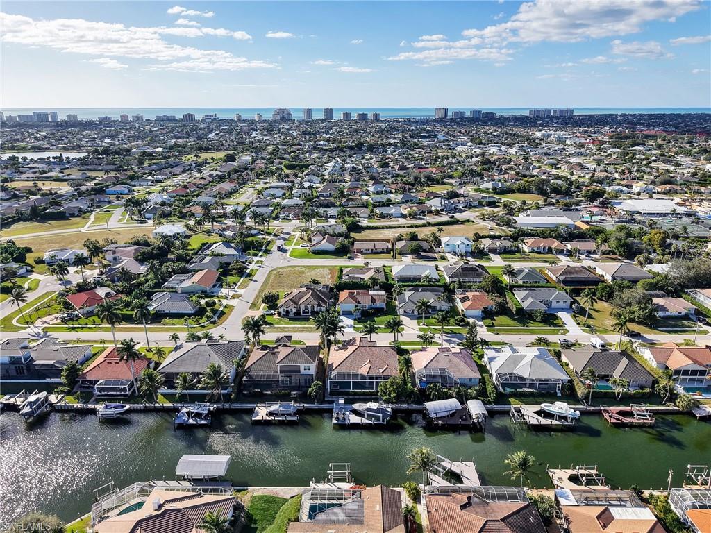 188 Columbus Way Marco Island, FL 34145 - Photo 34 of 38 Aerial perspective of suburban area featuring a large body of water