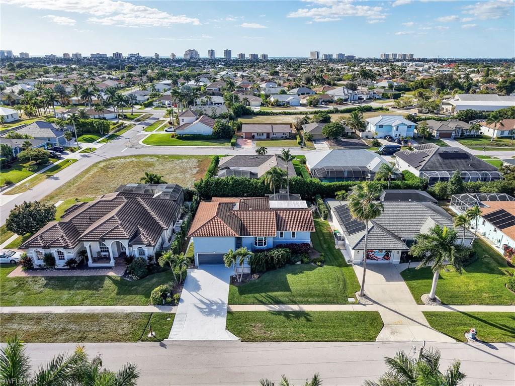 188 Columbus Way Marco Island, FL 34145 - Photo 35 of 38 Aerial view of residential area with skyline