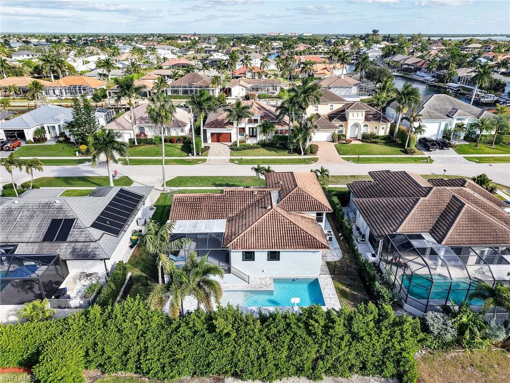 188 Columbus Way Marco Island, FL 34145 - Photo 37 of 38 Aerial perspective of suburban area featuring a pool