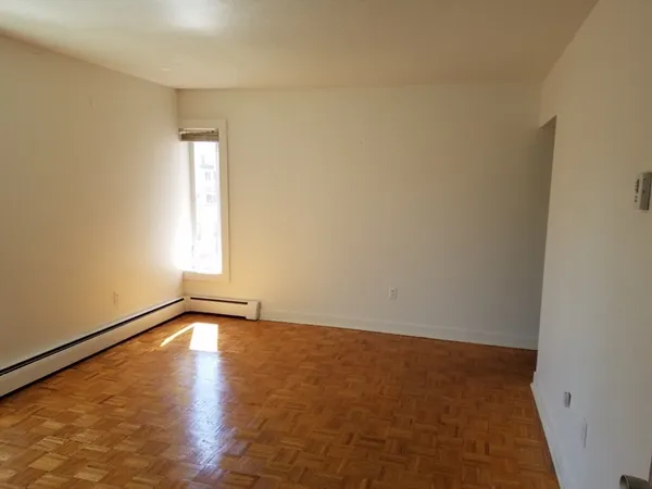 a view of an empty room and window