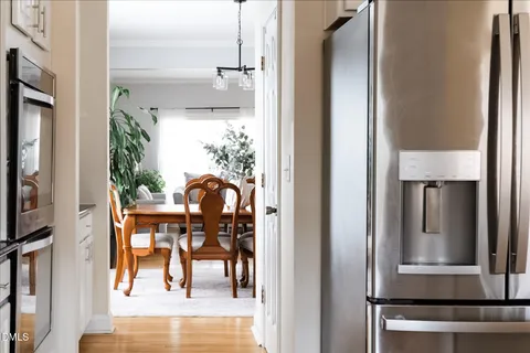 a view of a dining room with furniture and wooden floor