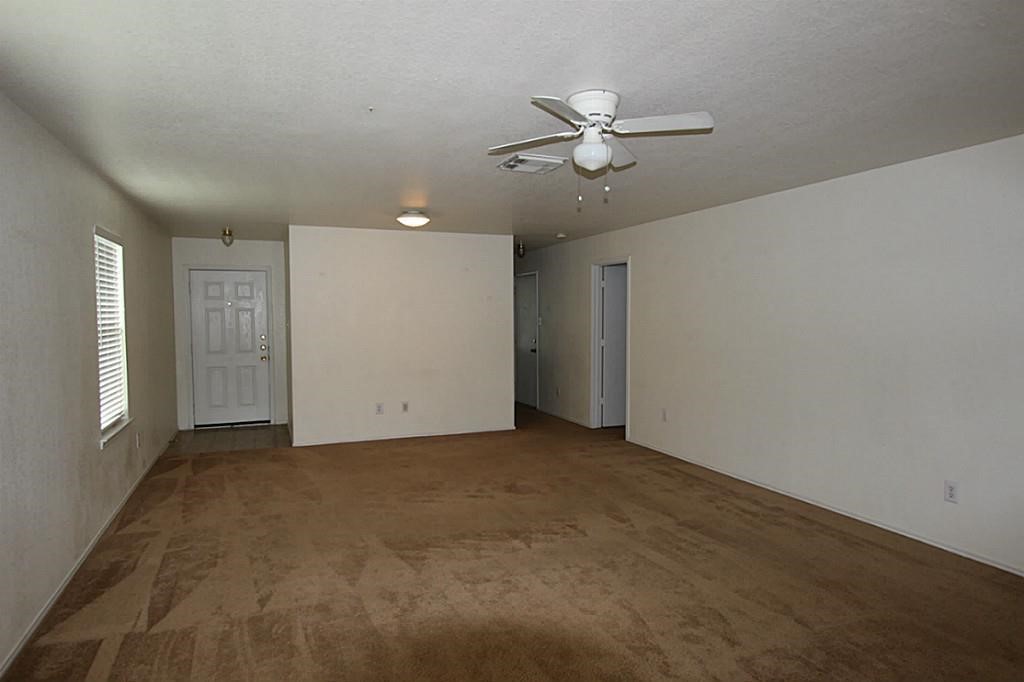5015 Fox Mill Lane Spring, TX 77389 - Photo 2 of 9 an empty room with fan walk in closet with window