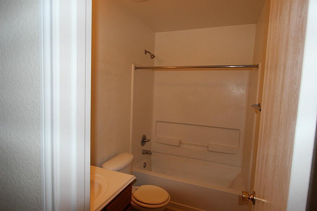 5015 Fox Mill Lane Spring, TX 77389 - Photo 3 of 9 a bathroom with a sink toilet and shower
