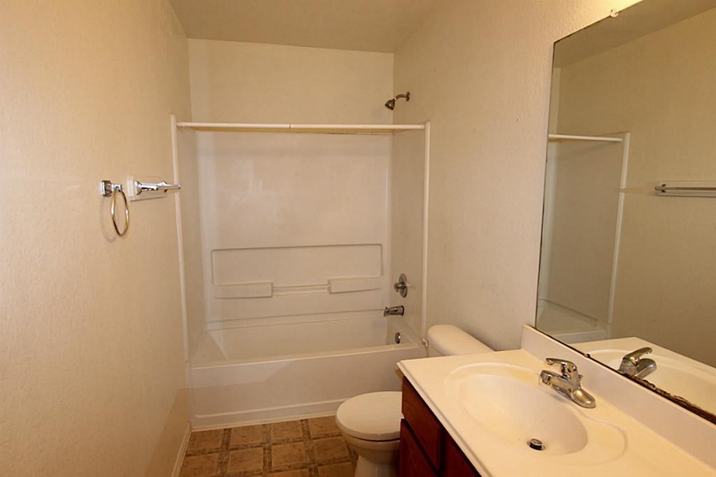 5015 Fox Mill Lane Spring, TX 77389 - Photo 4 of 9 a bathroom with a sink toilet and shower