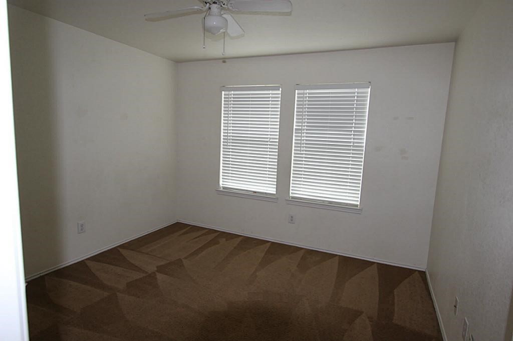 5015 Fox Mill Lane Spring, TX 77389 - Photo 5 of 9 an empty room with a window
