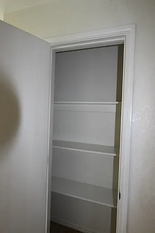 a view of an empty walk in closet