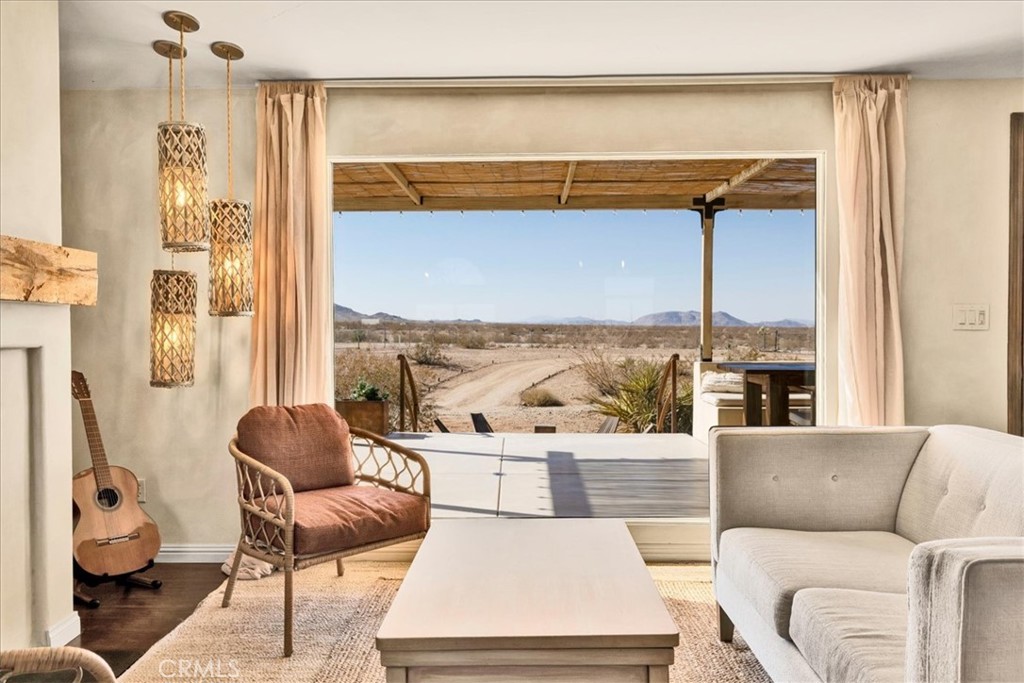 60707 Sonora Road Joshua Tree, CA 92252 - Photo 16 of 48 a living room with furniture and a large window