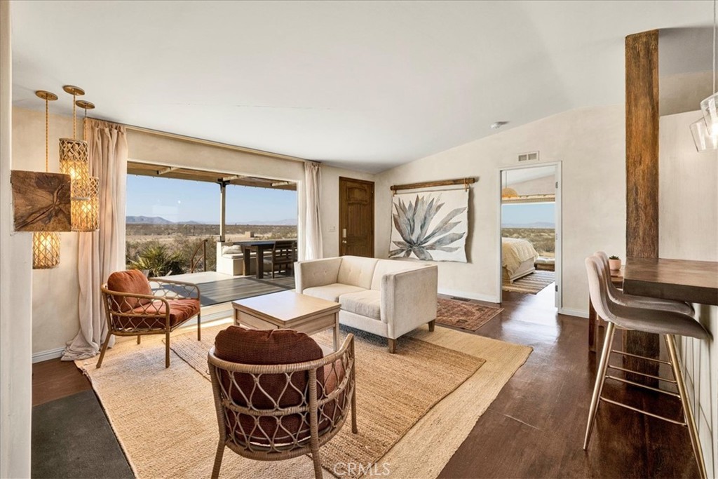 60707 Sonora Road Joshua Tree, CA 92252 - Photo 17 of 48 a living room with furniture and a large window