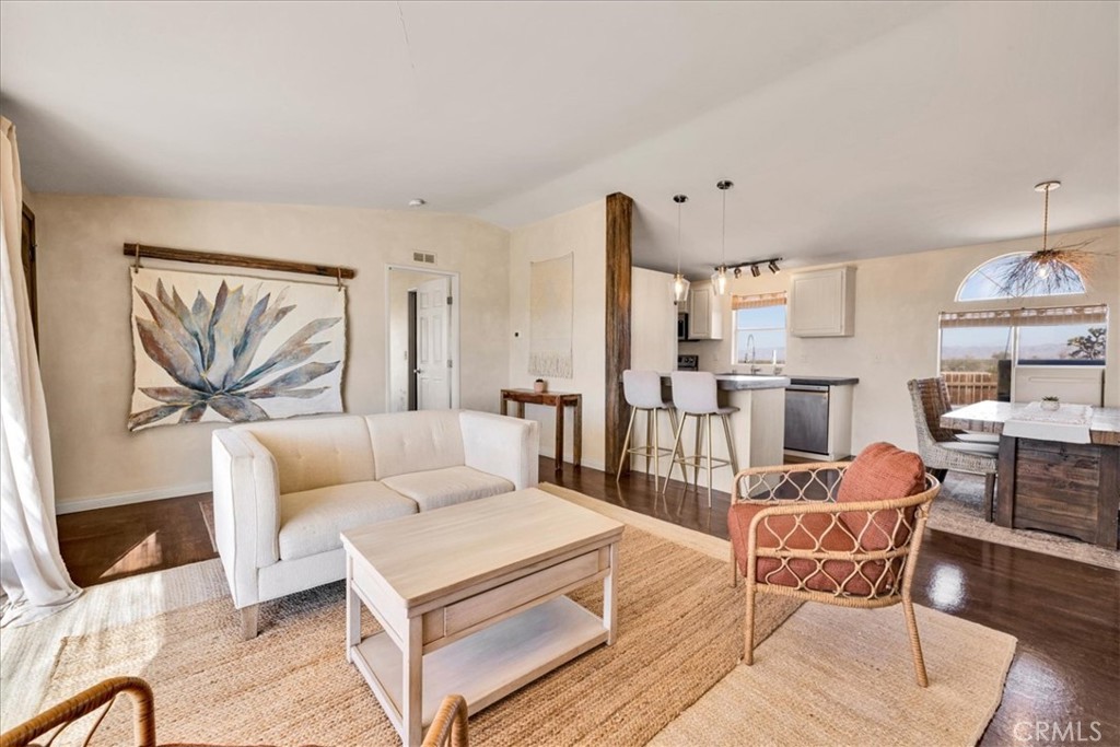 60707 Sonora Road Joshua Tree, CA 92252 - Photo 18 of 48 a living room with furniture and a large window