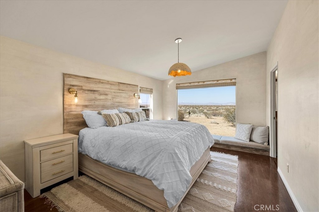 60707 Sonora Road Joshua Tree, CA 92252 - Photo 26 of 48 a bedroom with a bed and a window