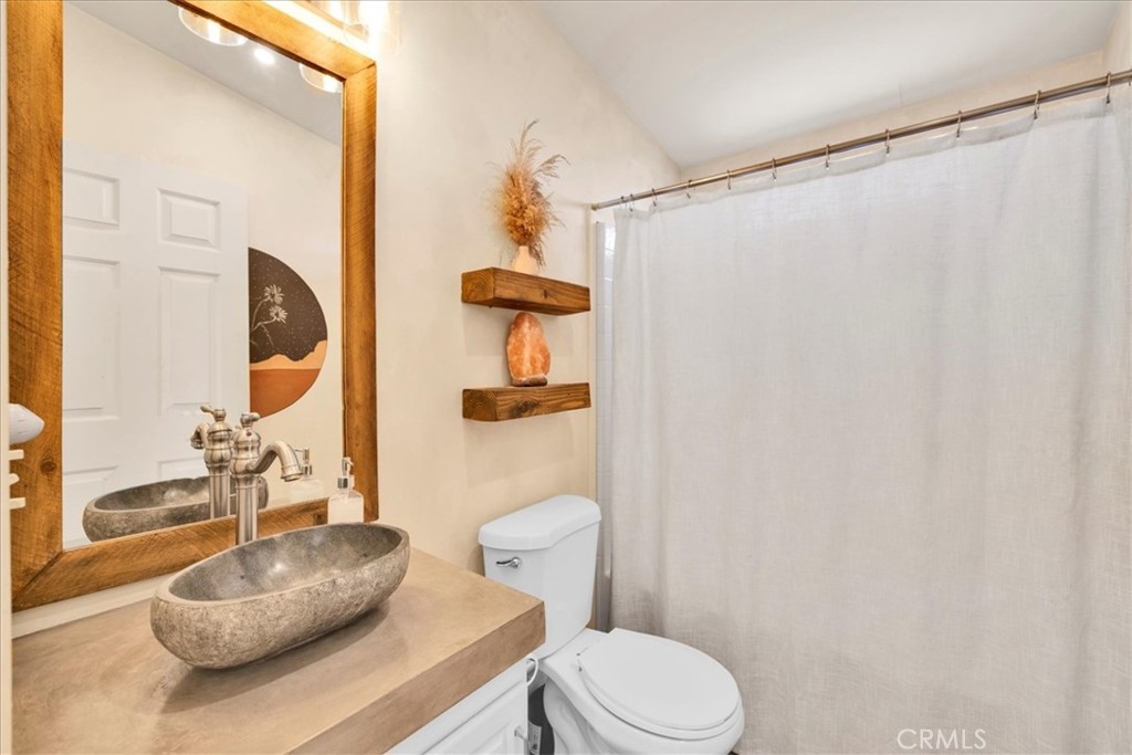 60707 Sonora Road Joshua Tree, CA 92252 - Photo 35 of 48 a bathroom with a sink a toilet and shower